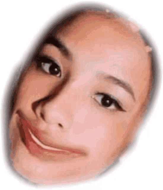 a close up of a woman 's face with a slight smile on her face .