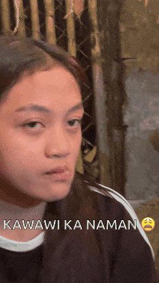 a girl is making a funny face and the words awaii ka naman are on the bottom