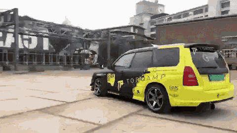 a yellow and black car with the word torqamp on it