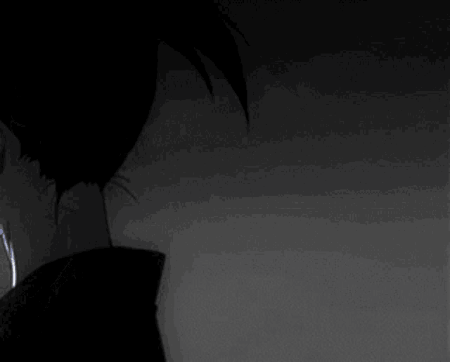 a black and white drawing of a character with blue eyes