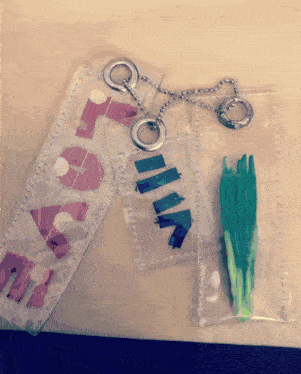 a plastic bag with the word rita on it next to a green vegetable