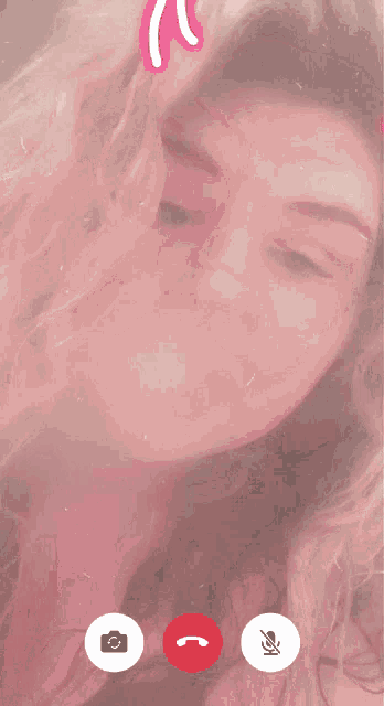 a woman is on a video call with a camera and microphone icons