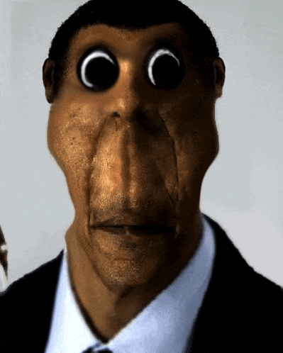 a close up of a man 's face with a monkey 's nose .