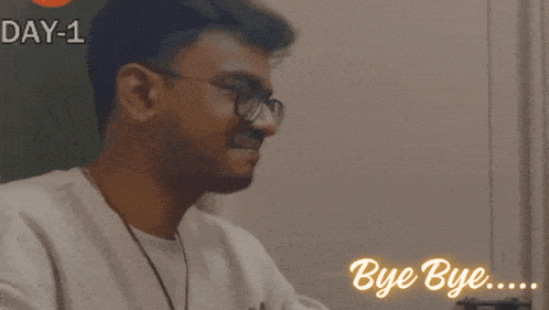 a man wearing glasses is saying bye bye in a video