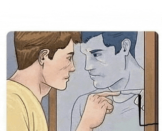 a man is looking at himself in a mirror .