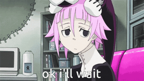 a girl with pink hair is sitting on a pink couch and says ok i 'll wait
