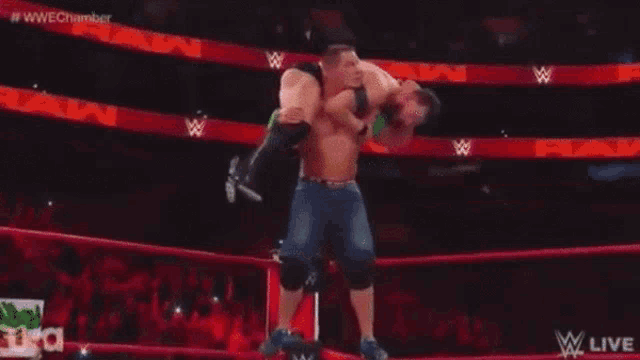 two men are wrestling in a wrestling ring with the words wwe chamber on the bottom of the screen .