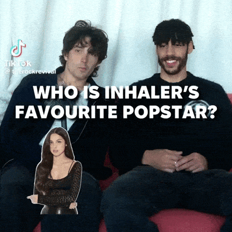 a man and a woman are sitting on a red couch and the caption says who is inhaler 's favourite popstar