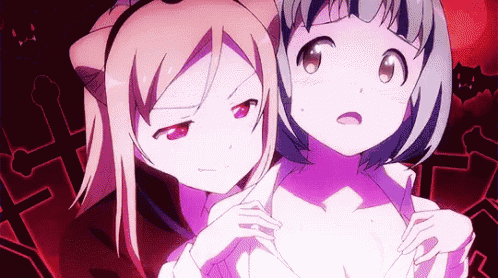 two anime girls are standing next to each other and one has a cat ear on her head .
