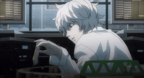 a man in a lab coat is looking at something in front of a window