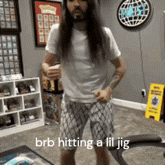 a man with long hair and a beard is standing in a room with the words brb hitting a lil jig above him .