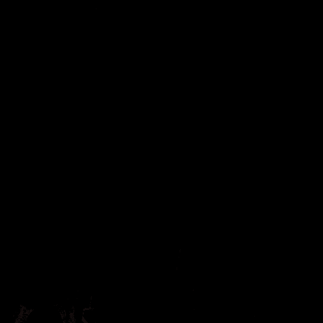 a close up of a man 's face with a black background and a gray collar