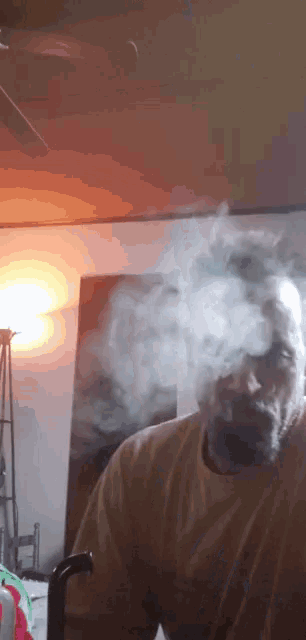a man with a beard smoking a cigarette in a room