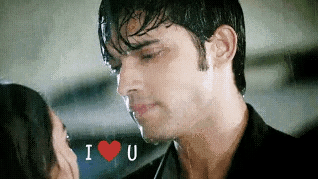 a man and a woman are kissing in the rain with the words i love u written above them