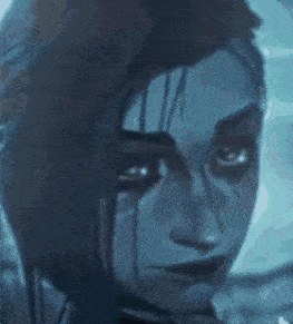 a close up of a woman 's face with blood coming out of her eye .
