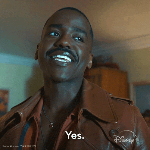 a man with a mustache is smiling and says yes on a disney + ad