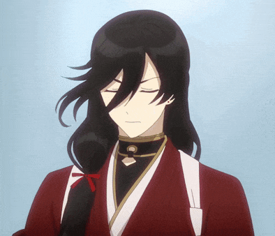 a man with long black hair wearing a red kimono