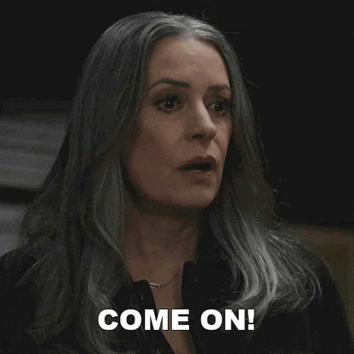 a woman with gray hair says come on in front of her face