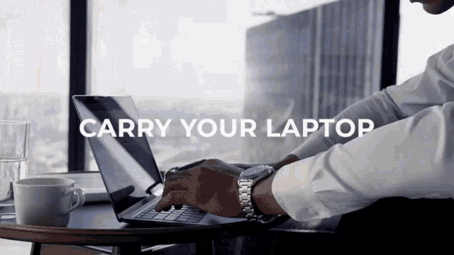 a man is typing on a laptop with the words " carry your laptop " behind him