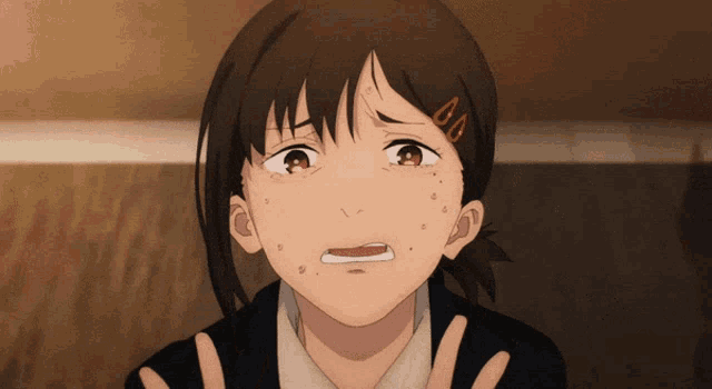 a close up of a girl 's face with a tear running down her cheek