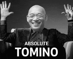 a bald man is sitting in a chair with his arms in the air and smiling .