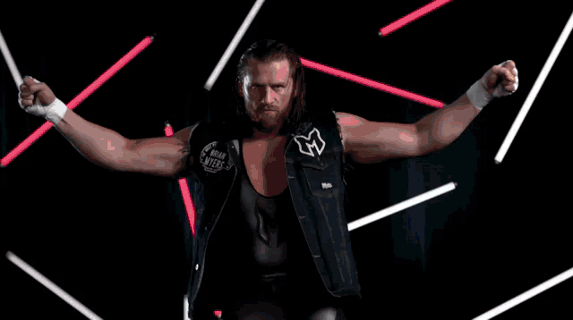 a man in a wrestling ring with a shirt that says killer on it