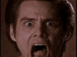 a close up of a man 's face with his mouth wide open
