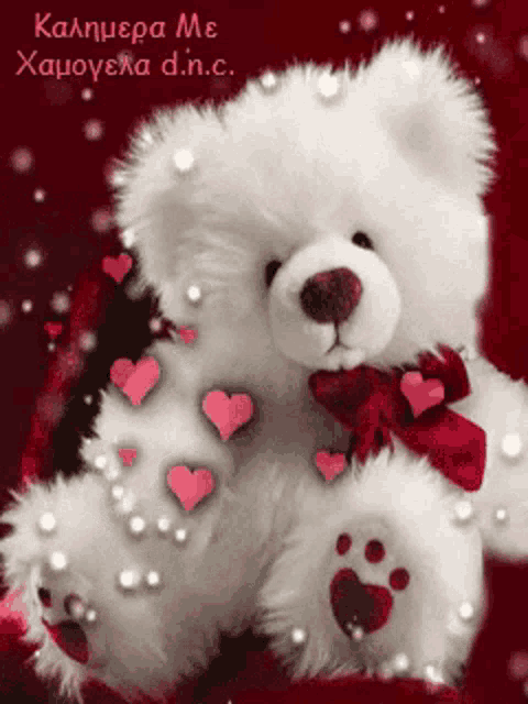 a teddy bear with hearts and pearls on it