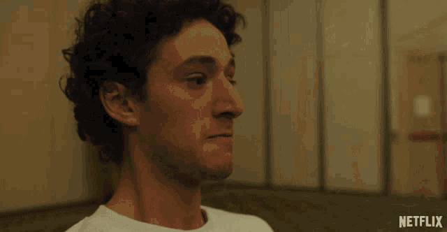 a close up of a man 's face with a netflix logo on the bottom
