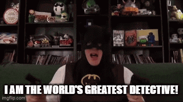 a man in a batman mask says i am the world 's greatest detective .