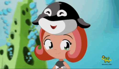 a discovery kids advertisement with a girl wearing a whale hat on her head