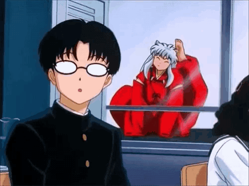 a boy wearing glasses is standing in front of a window with a dog in a red costume behind him .