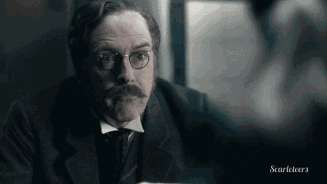 a man with glasses and a mustache is in a scarleteers ad