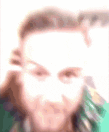 a blurry picture of a woman 's face with a brush .