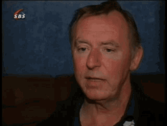 a man is being interviewed by sbs in a video