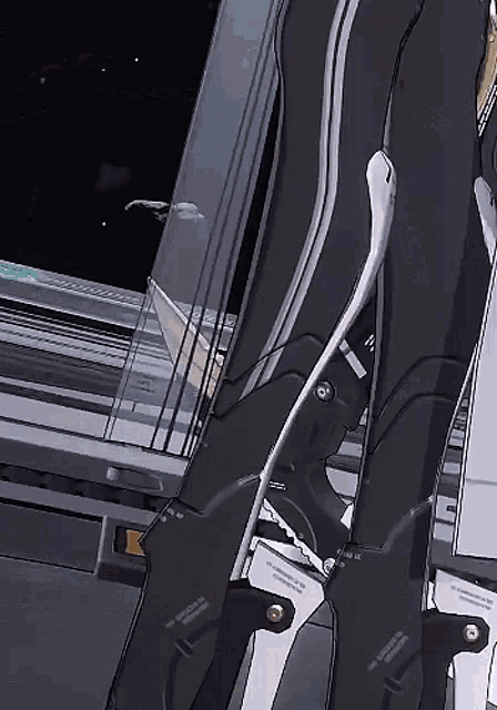 a close up of a person 's legs in a futuristic suit with a sword