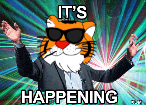 a man in a suit with a tiger on his head and the words it 's happening