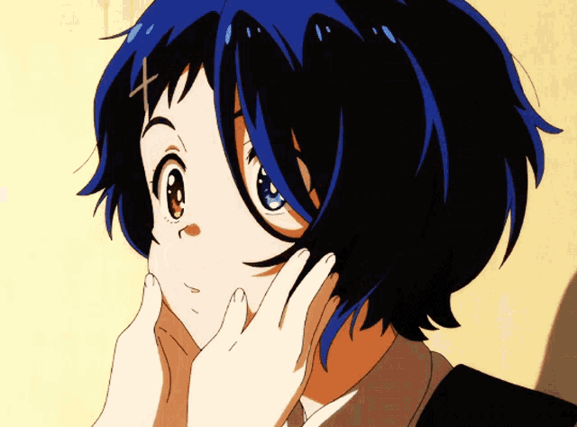 a girl with blue hair and a cross on her head