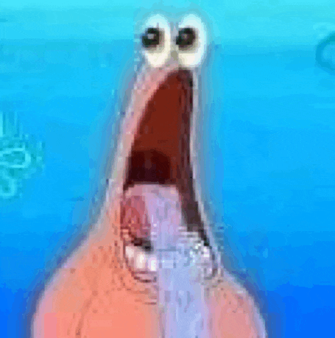 a close up of patrick star from spongebob squarepants with his mouth open and big eyes .