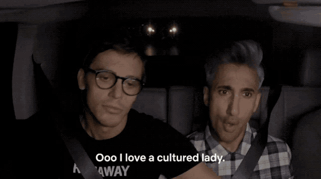 two men are sitting in a car and one of them says " ooo i love a cultured lady .. "