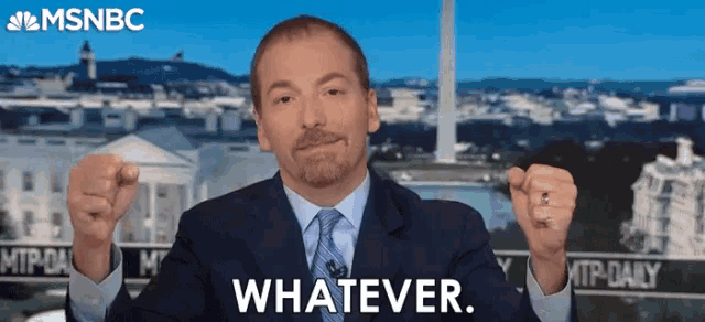 a man in a suit and tie says whatever in front of the msnbc logo