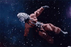a person in an astronaut 's suit is floating in space surrounded by stars .