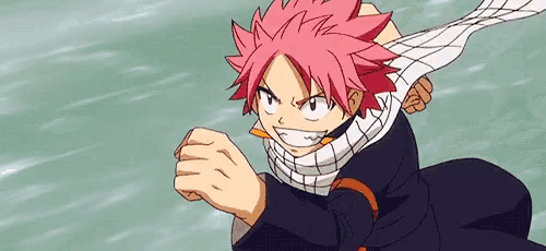 a person with red hair and a scarf around their neck