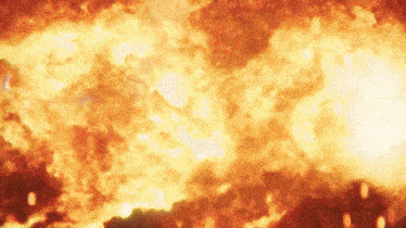 a large explosion with lots of flames and smoke