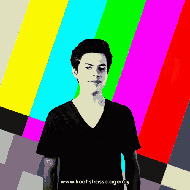 a man is standing in front of a colorful background with the website www.kochstrasse.agency written below him