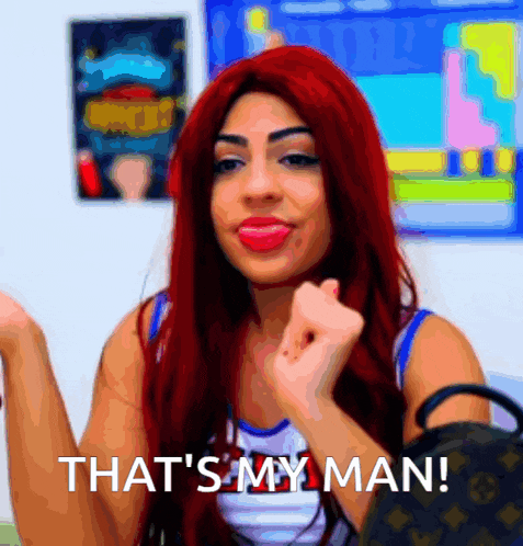 a woman with red hair has the words that 's my man on her face