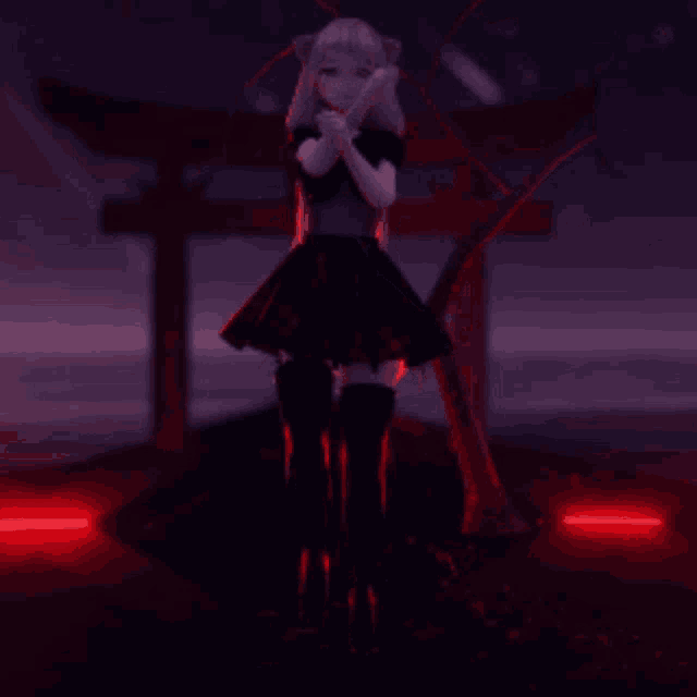 a girl in a black dress stands in front of a cross