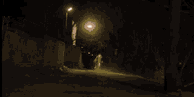 a light bulb is shining in a dark room .