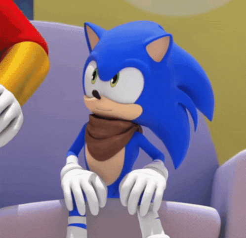 sonic the hedgehog is sitting on a couch wearing a scarf around his neck