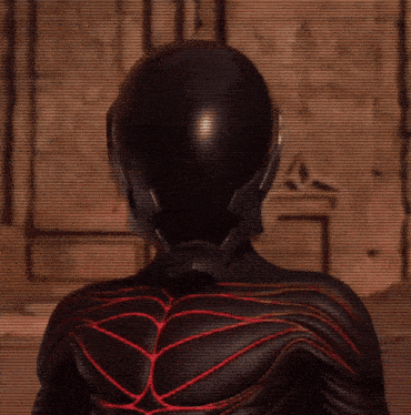 a close up of a black helmet with red stripes
